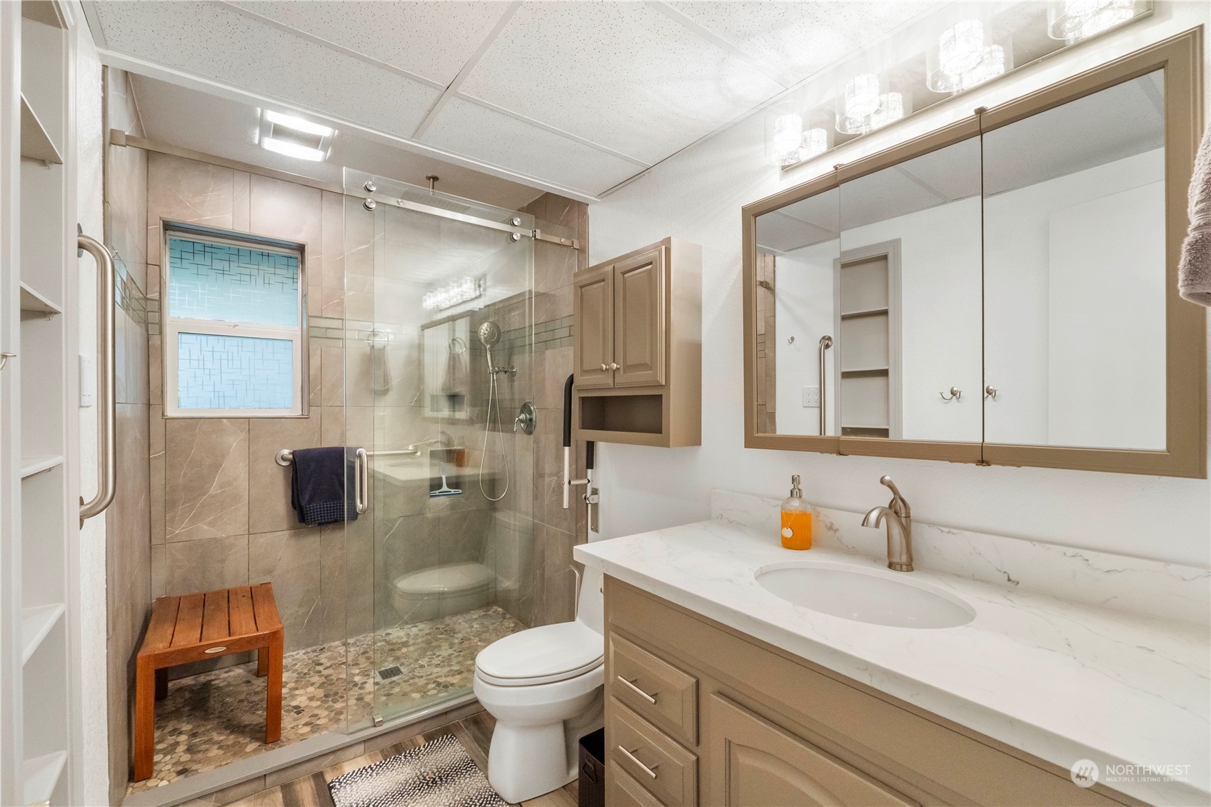 4906 200th Street Southeast Bothell, WA 98012 - Photo 35 of 40 a bathroom with a sink toilet and shower