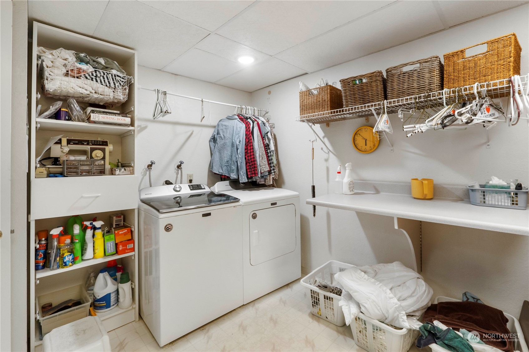 4906 200th Street Southeast Bothell, WA 98012 - Photo 36 of 40 a view of walk in closet with clothes and shoes