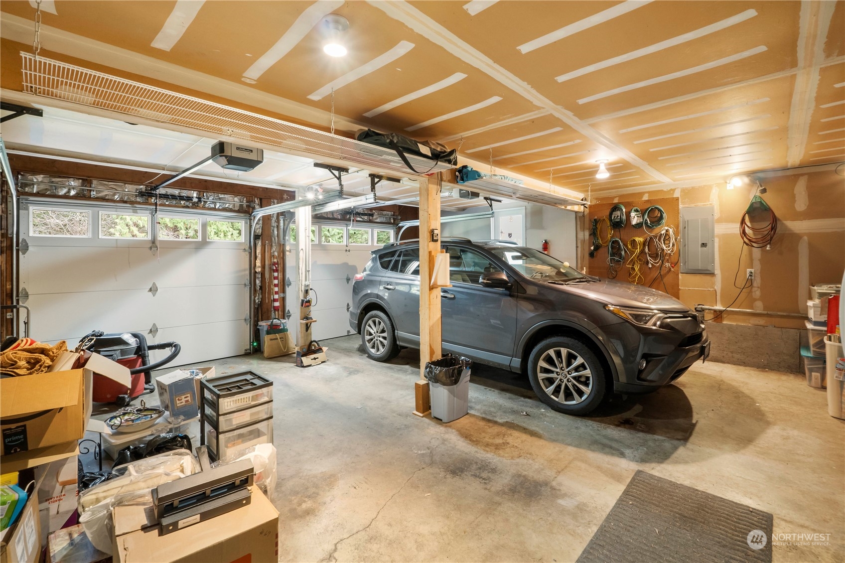 4906 200th Street Southeast Bothell, WA 98012 - Photo 40 of 40 a view of a garage with a car and parked