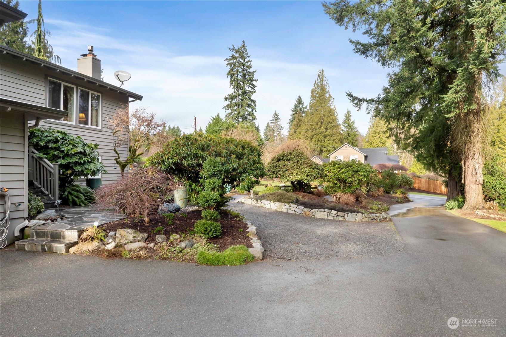 4906 200th Street Southeast Bothell, WA 98012 - Photo 4 of 40 a view of a street with a house in background