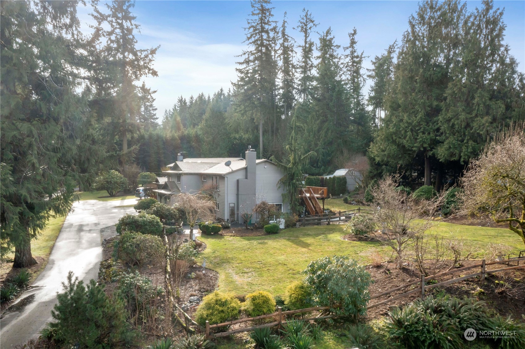 4906 200th Street Southeast Bothell, WA 98012 - Photo 5 of 40 a view of a yard with large trees
