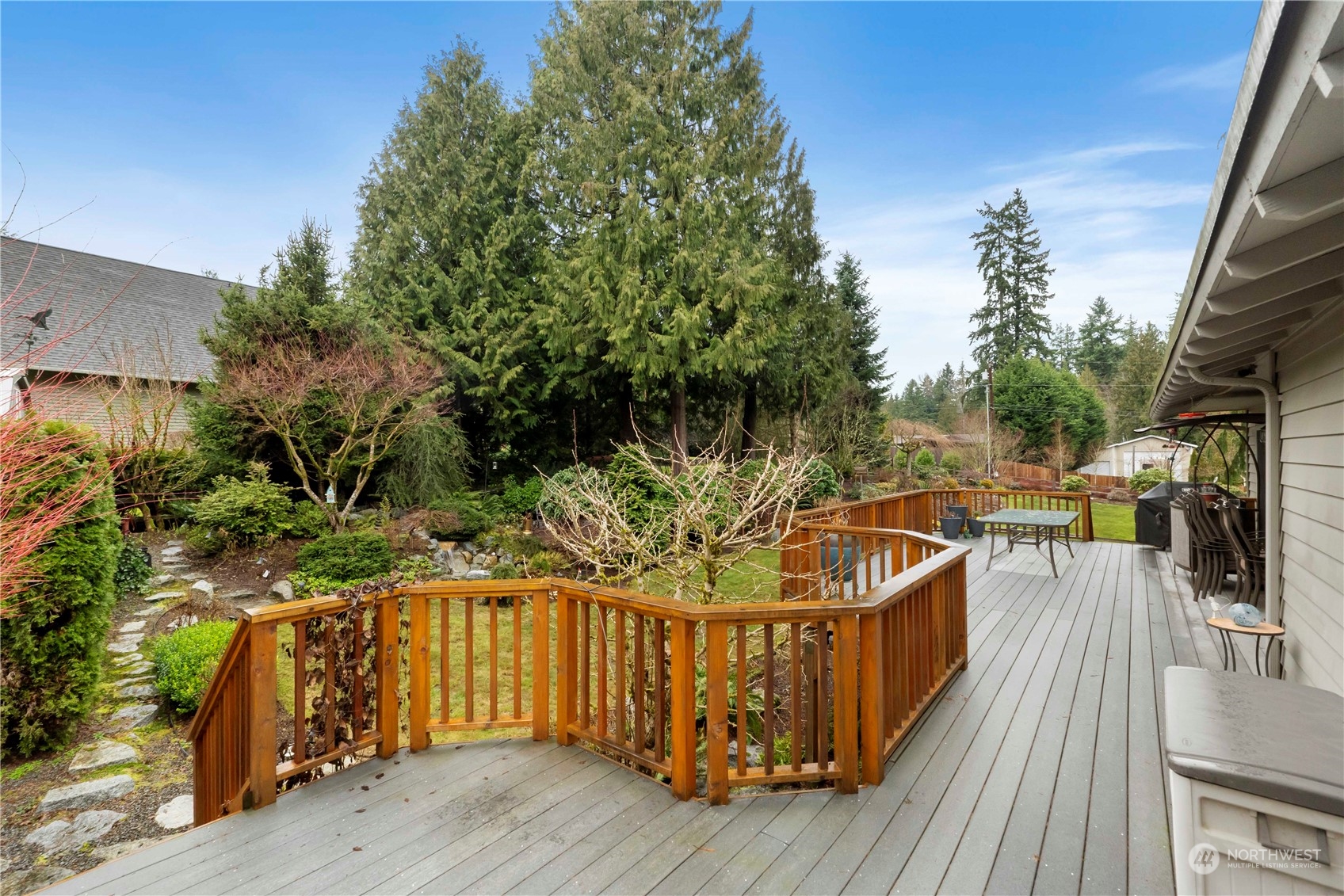 4906 200th Street Southeast Bothell, WA 98012 - Photo 10 of 40 a view of a couches on the deck with wooden floor