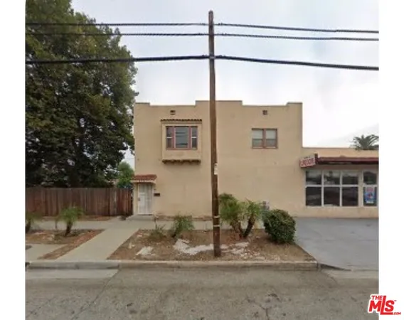 a view of a house with a street