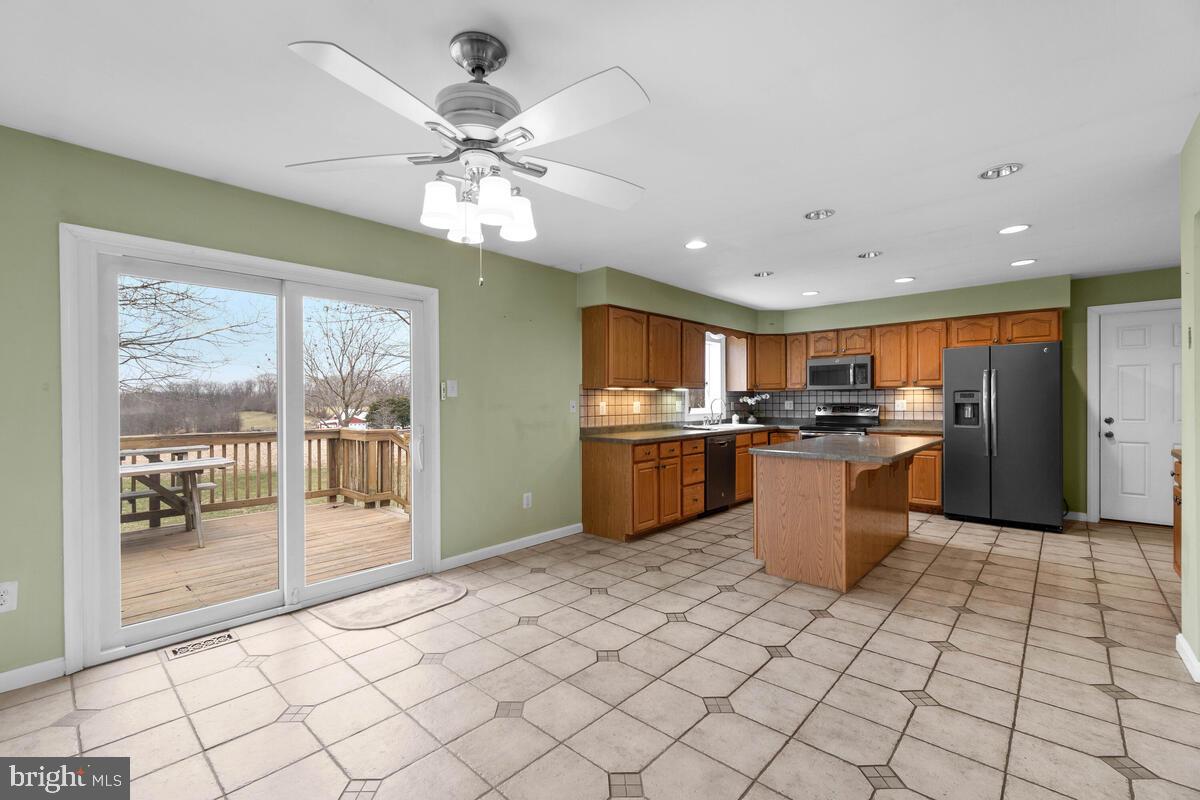 1005 Muller Road Westminster, MD 21157 - Photo 14 of 52 Kitchen - Ceiling Fan, sliding glass door to deck