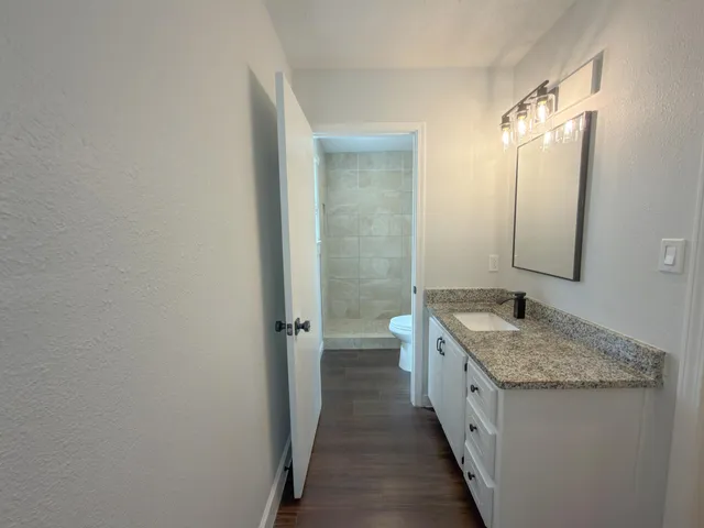 a bathroom with a shower and toilet
