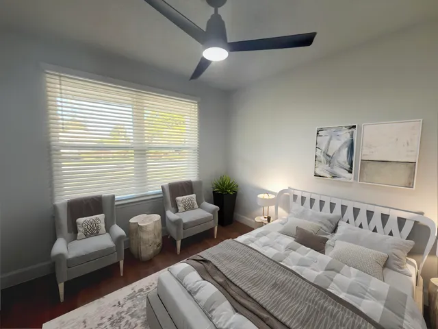 a bathroom with a granite countertop toilet and a sink