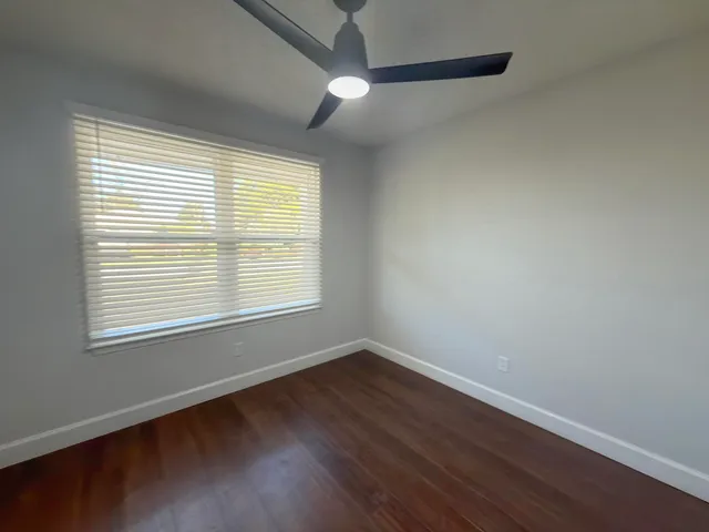a view of room that has a white walls