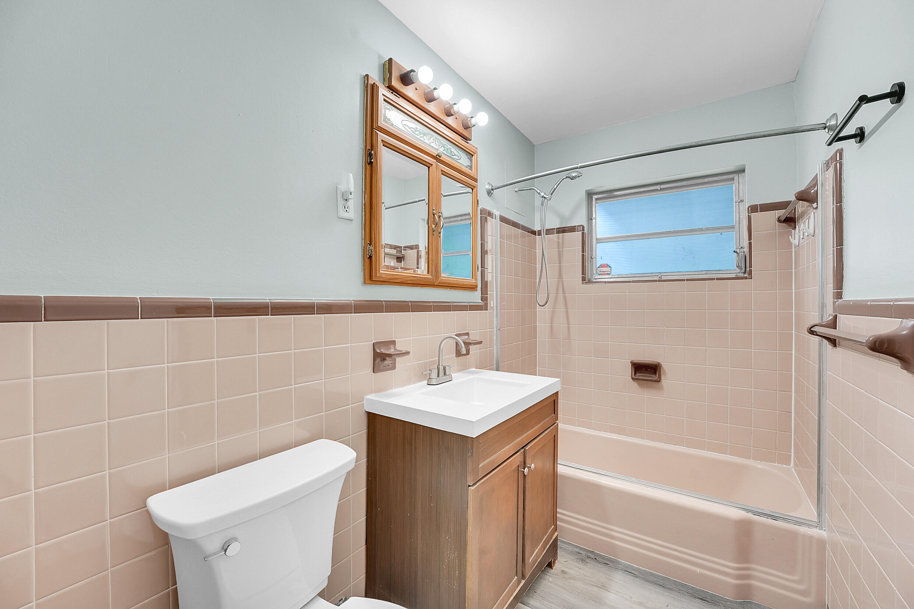 302 West Arbor Avenue Port St. Lucie, FL 34952 - Photo 15 of 25 a bathroom with a sink toilet and shower