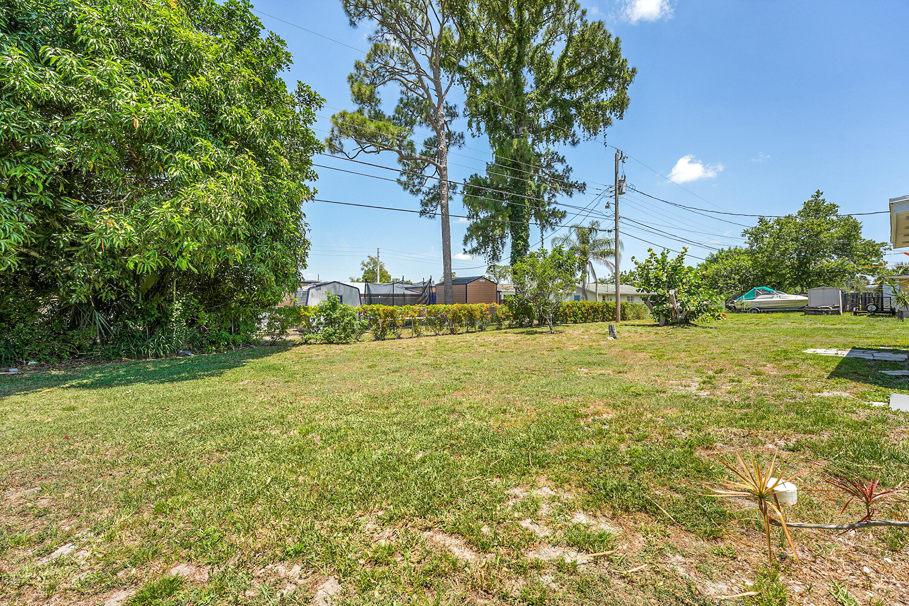 302 West Arbor Avenue Port St. Lucie, FL 34952 - Photo 23 of 25 a view of an house with backyard space and garden