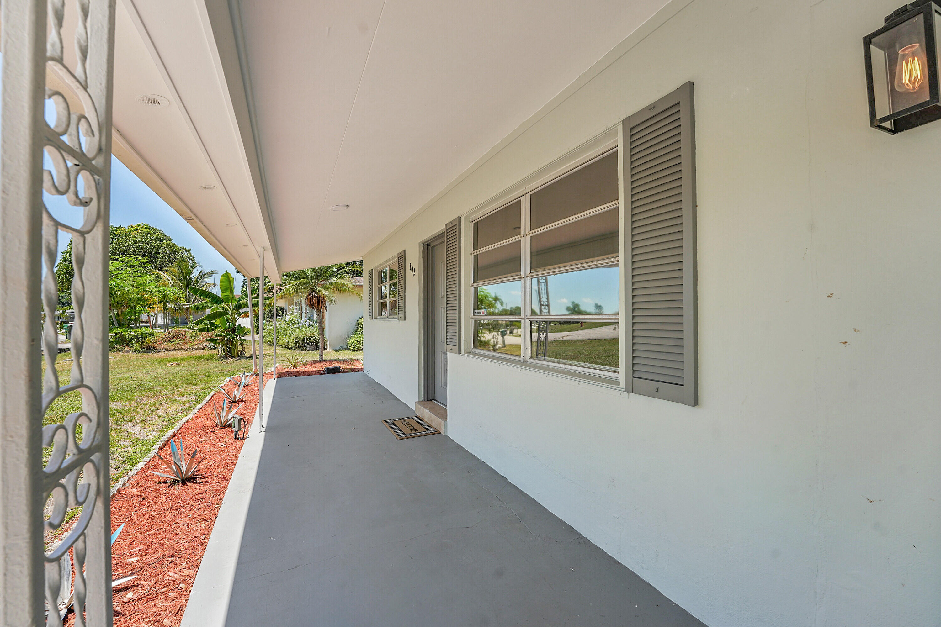 302 West Arbor Avenue Port St. Lucie, FL 34952 - Photo 4 of 25 a view of balcony and floor to ceiling windows