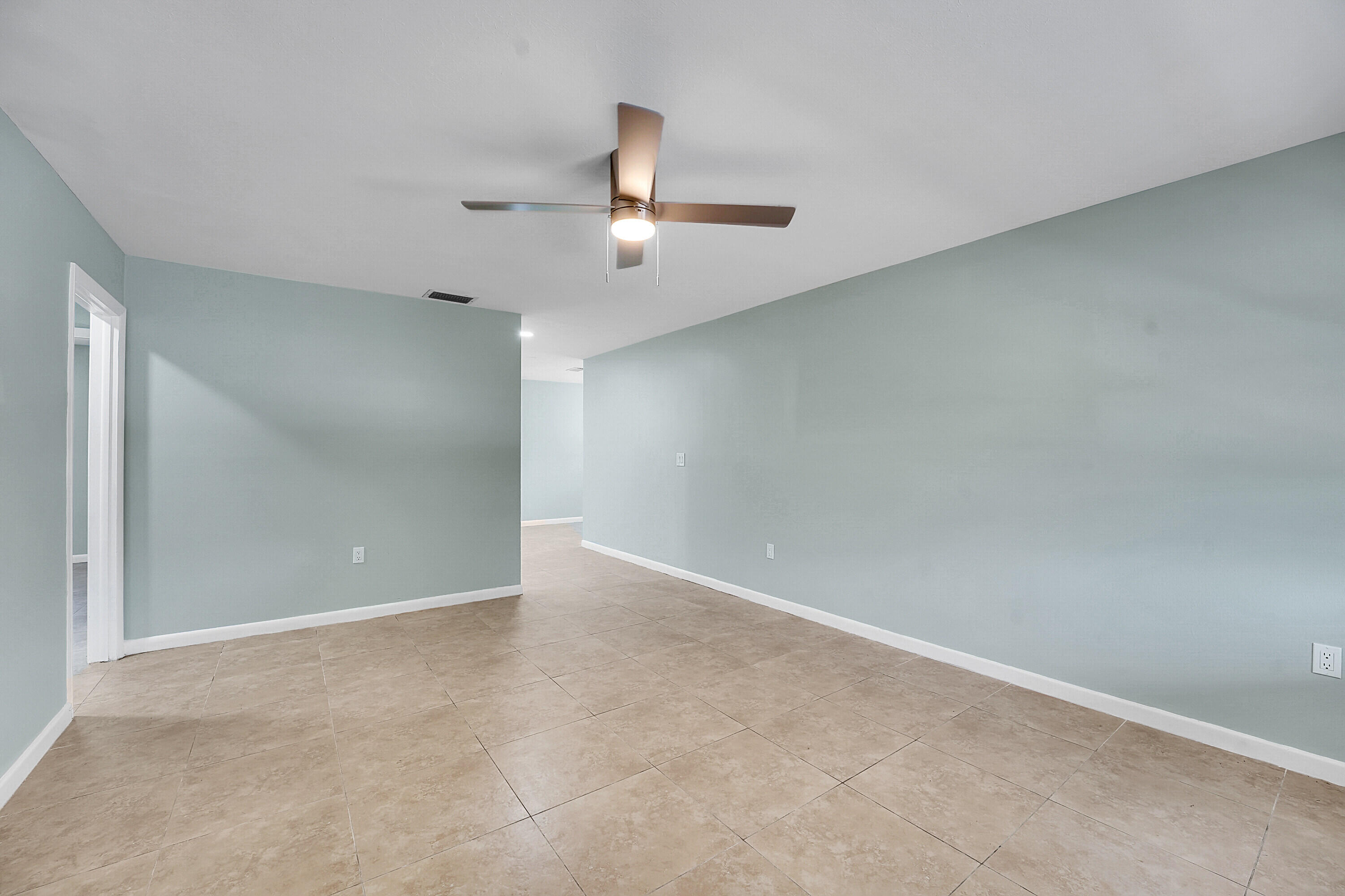 302 West Arbor Avenue Port St. Lucie, FL 34952 - Photo 5 of 25 wooden floor in an empty room