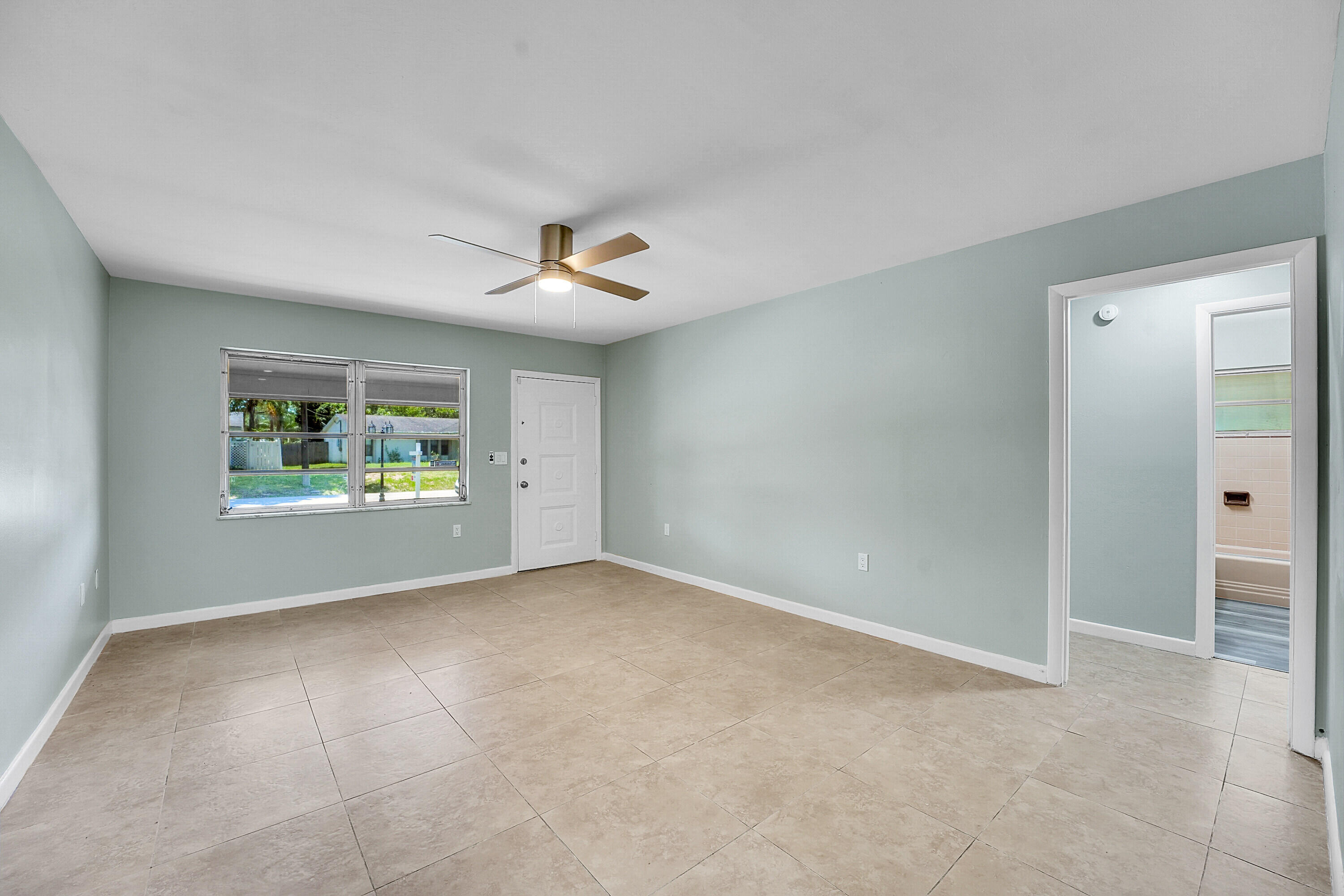302 West Arbor Avenue Port St. Lucie, FL 34952 - Photo 7 of 25 a view of an empty room with a window