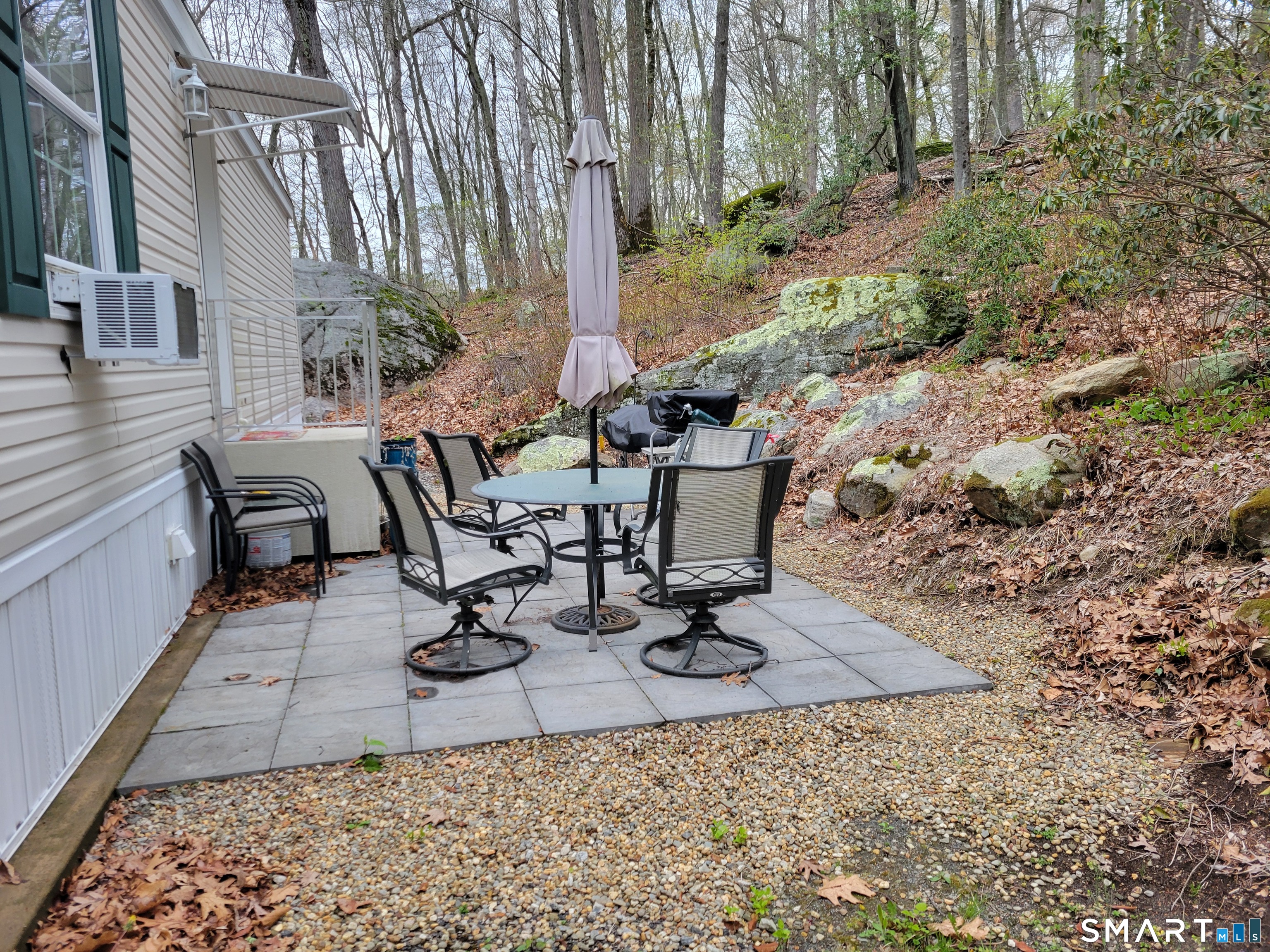 301 Buddington Road Groton, CT 06340 - Photo 4 of 6 a view of a backyard with sitting area
