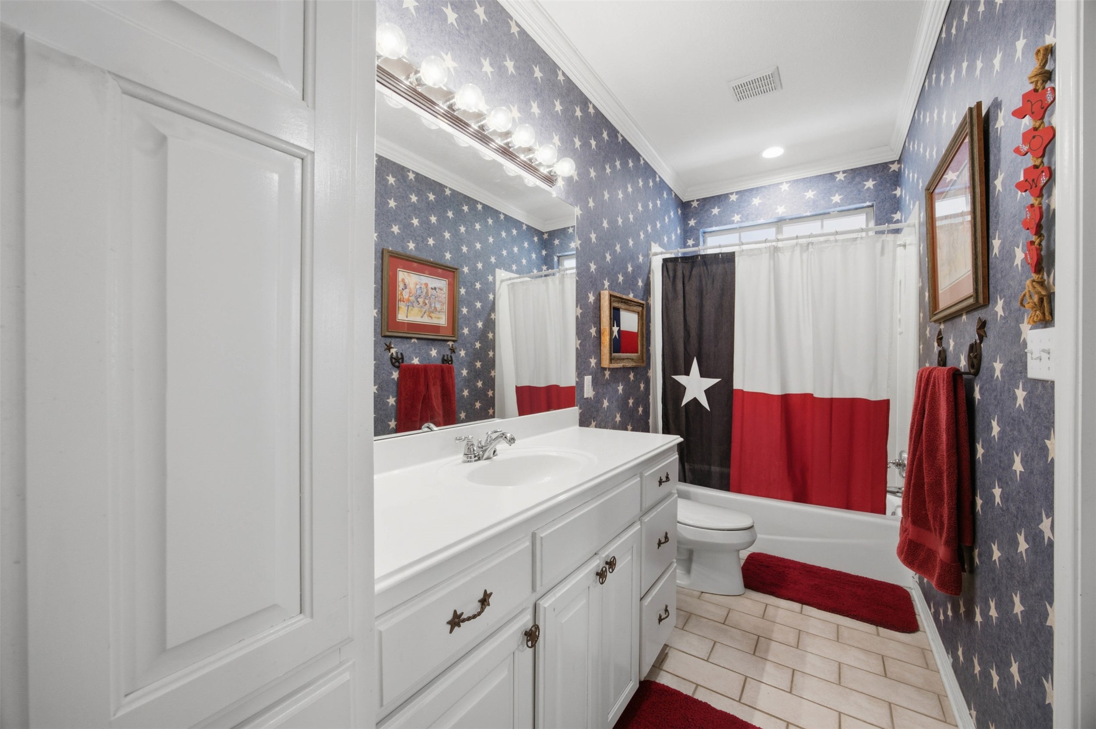 197 Elm Wood Drive Elgin, TX 78621 - Photo 20 of 37 A pristine white vanity with ample counter space and cabinet storage creates a clean, functional bathing area.