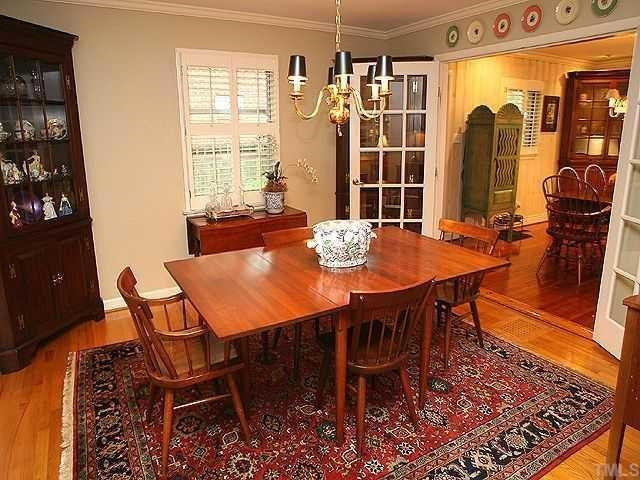 2605 Wells Avenue Raleigh, NC 27608 - Photo 5 of 12 Formal dining room featuring hardwood floors opens to the breakfast room through french doors and also opens to the family and living rooms! Dining Room