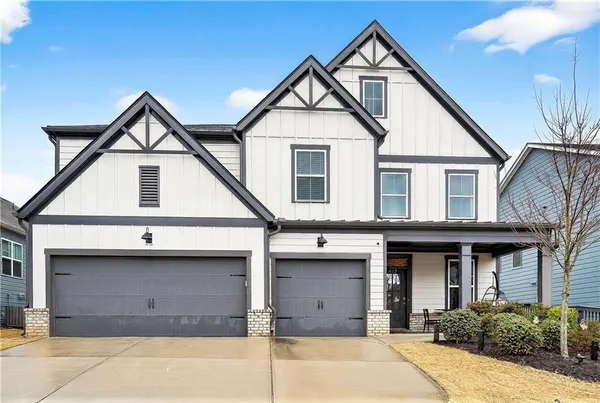 a front view of a house with garage
