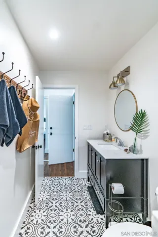 a kitchen with stainless steel appliances a sink and a large window