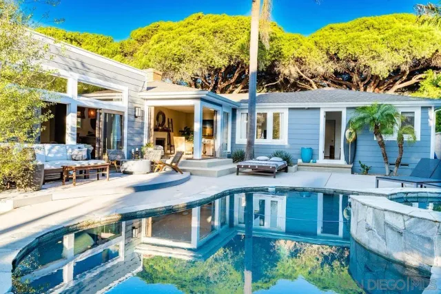 a view of a patio with table and chairs and potted plants