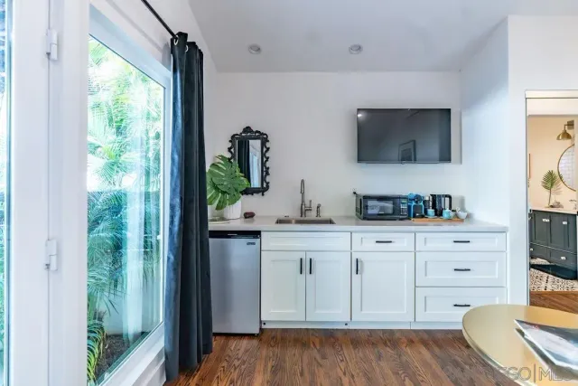 a bedroom with furniture and a window