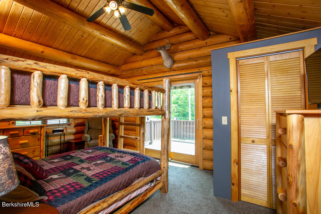 214 Mohawk Trail Florida, MA 01247 - Photo 21 of 40 a bedroom with furniture and large window