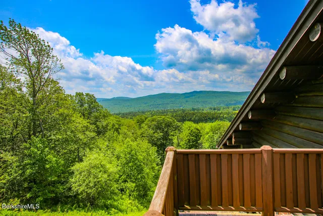 a view of balcony with wooden floor