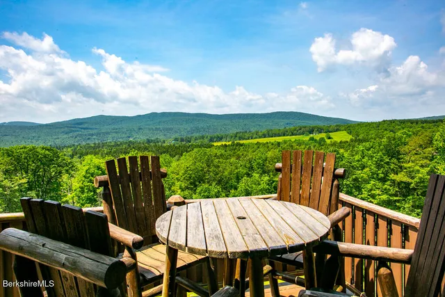 a view of a patio with a table chairs and a table
