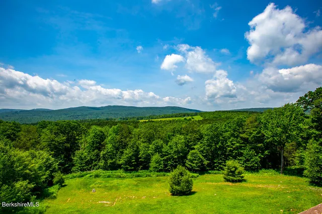 a view of a lake with a yard