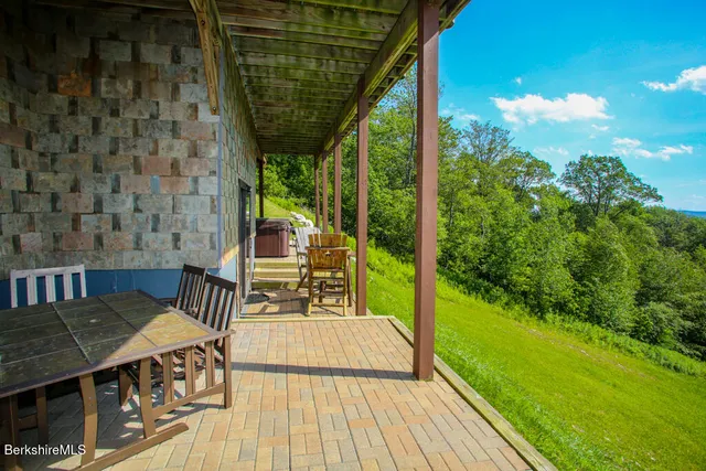 a view of a balcony with chairs