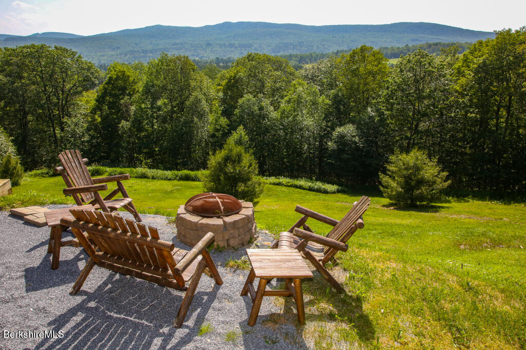 214 Mohawk Trail Florida, MA 01247 - Photo 33 of 40 a view of a swimming pool with a patio and a garden