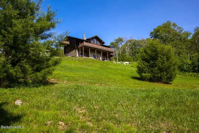 a view of a house with a big yard