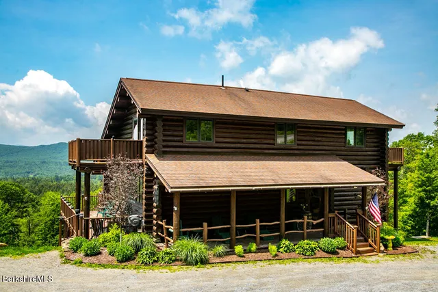 a front view of a house with garage
