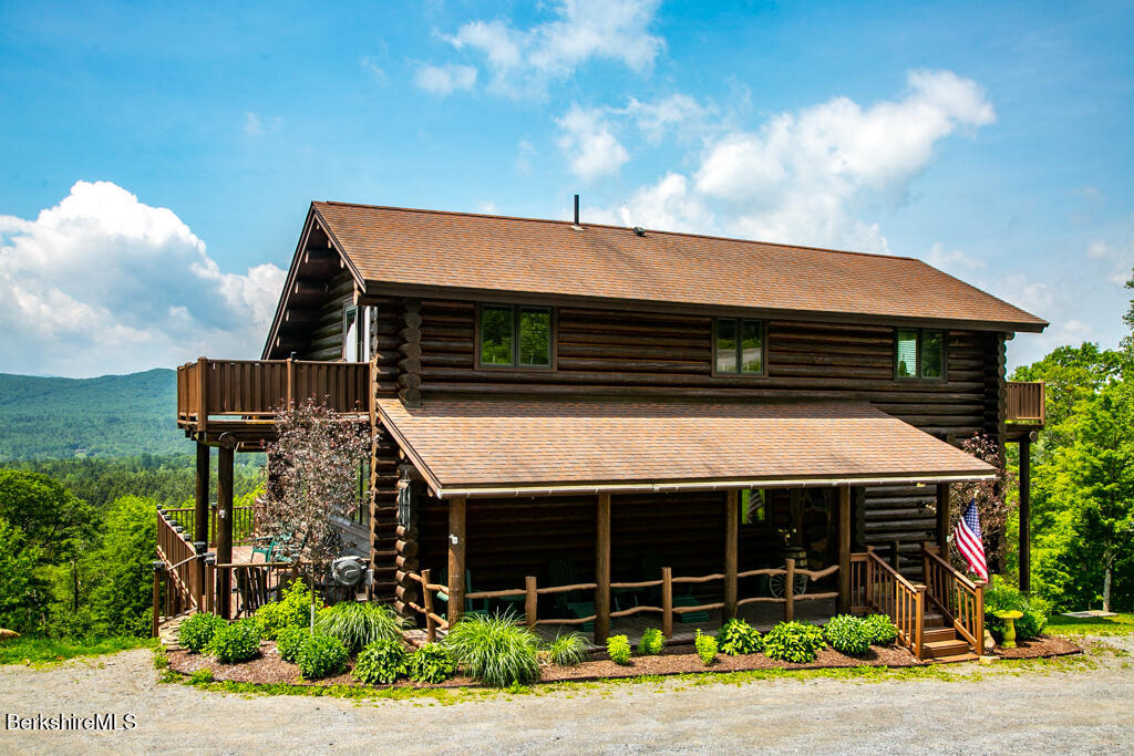214 Mohawk Trail Florida, MA 01247 - Photo 6 of 40 a front view of a house with garage