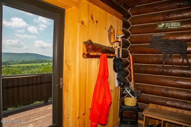 a view of walk in closet with clothes