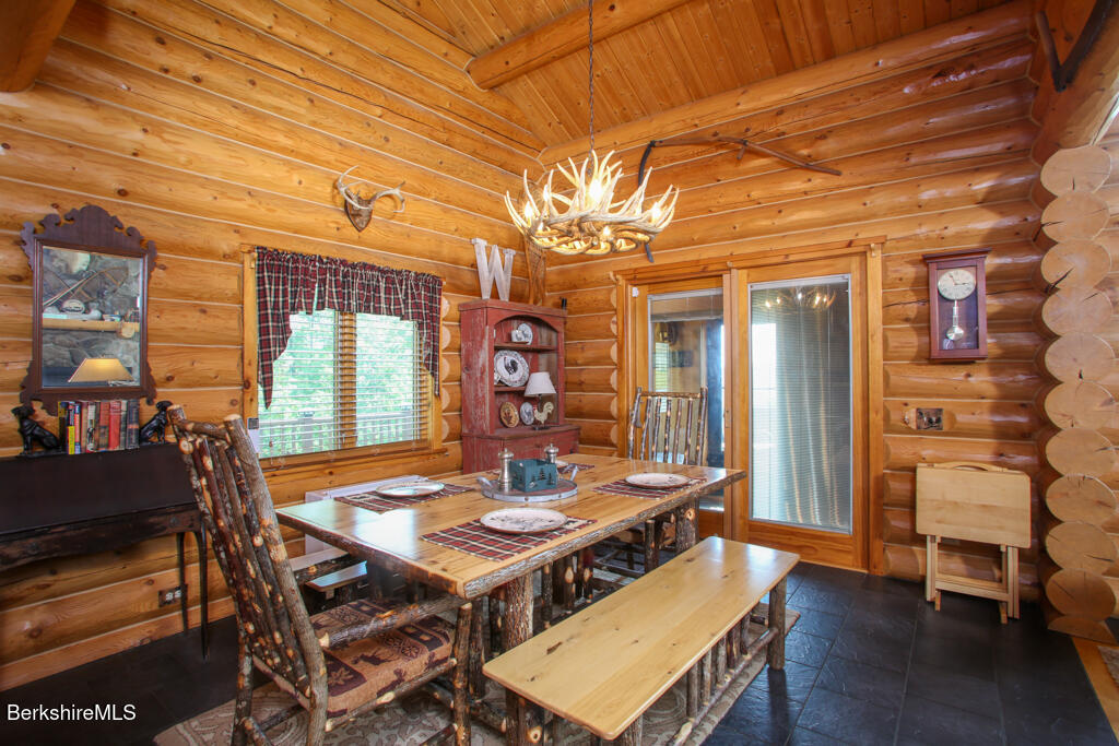 214 Mohawk Trail Florida, MA 01247 - Photo 10 of 40 a view of a dining room with furniture window and wooden floor