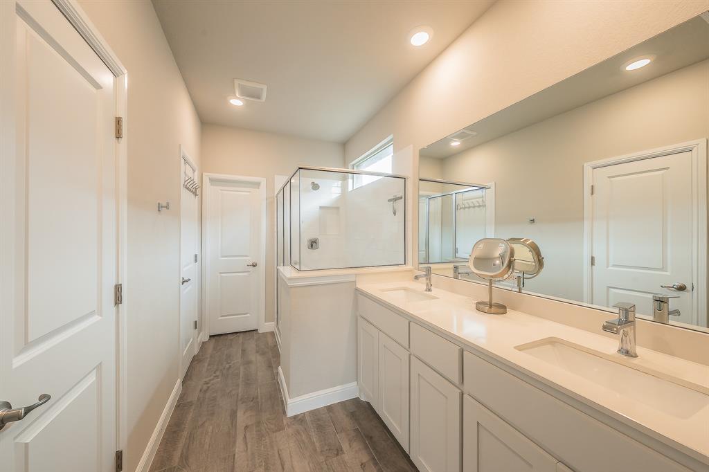 1212 Bosque Lane Weatherford, TX 76087 - Photo 28 of 38 a bathroom with a double vanity sink mirror and shower