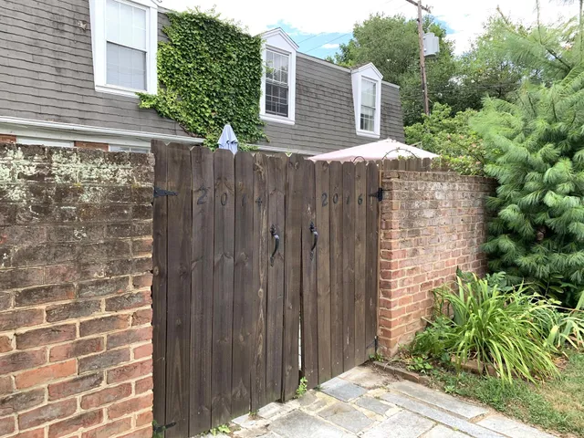 a view of a wooden door with a backyard