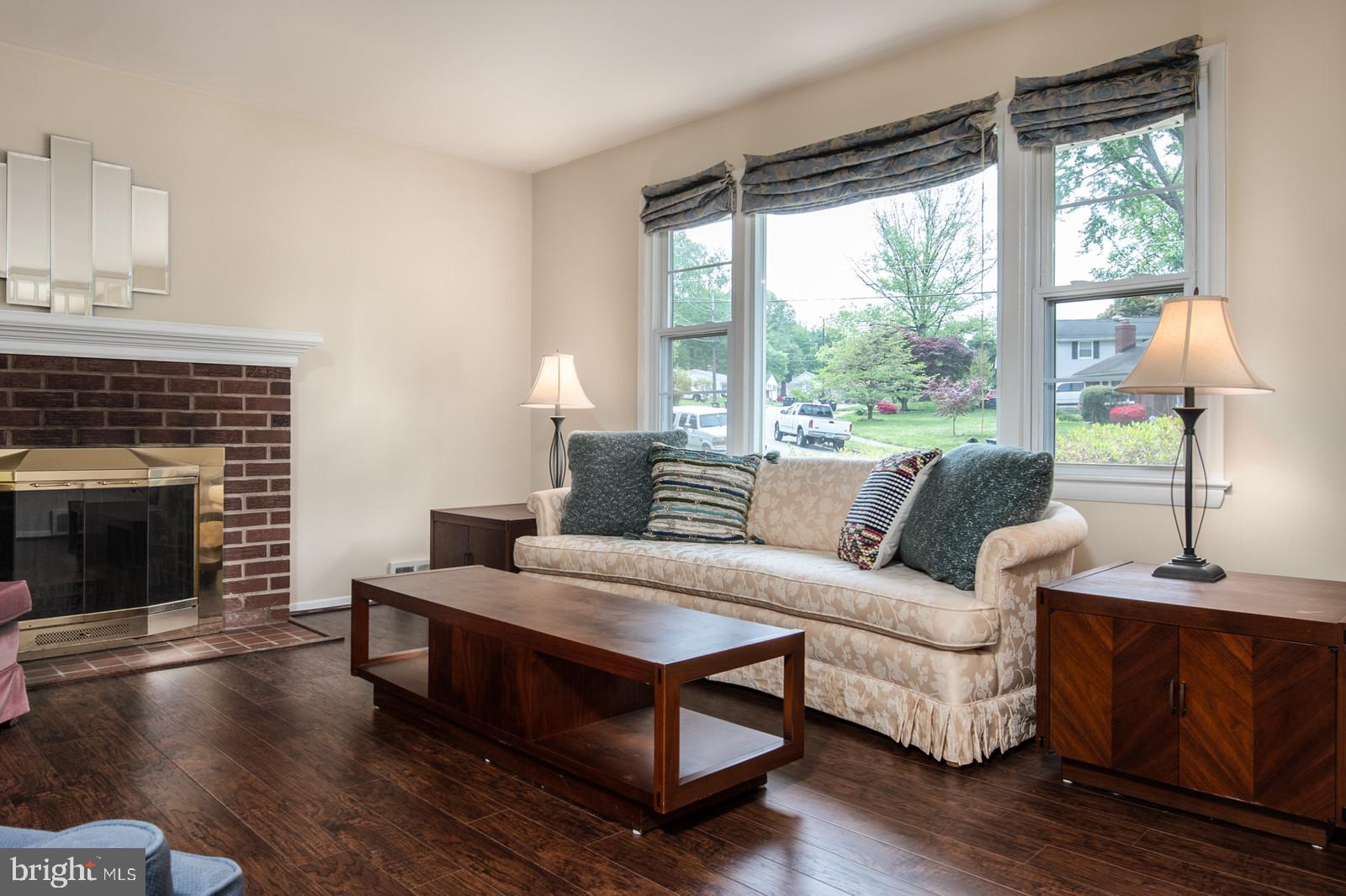 5942 Atteentee Road Springfield, VA 22150 - Photo 5 of 38 Bright Living Room with Wood-burning Fireplace