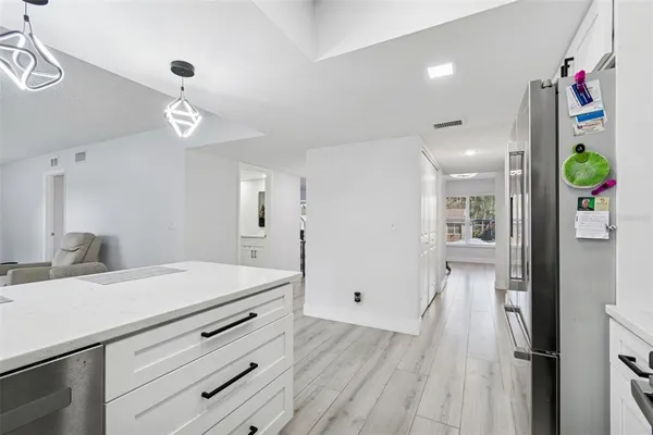a kitchen with a sink stove and microwave