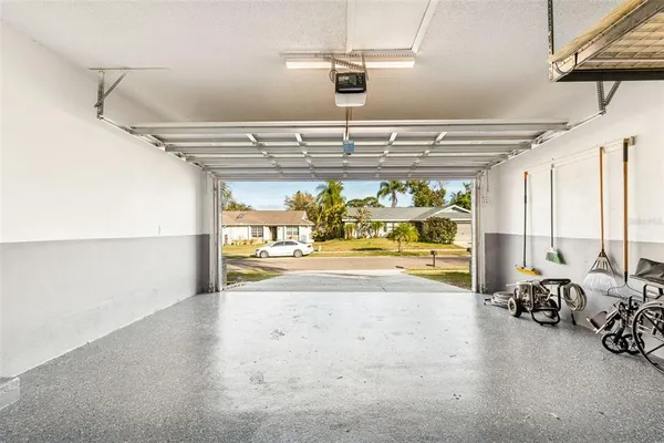 an aerial view of residential building with green space