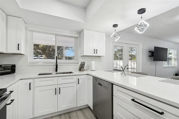 a kitchen with a sink and cabinets