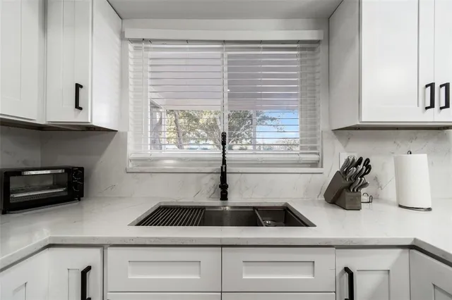 a room with a bed and a mirror