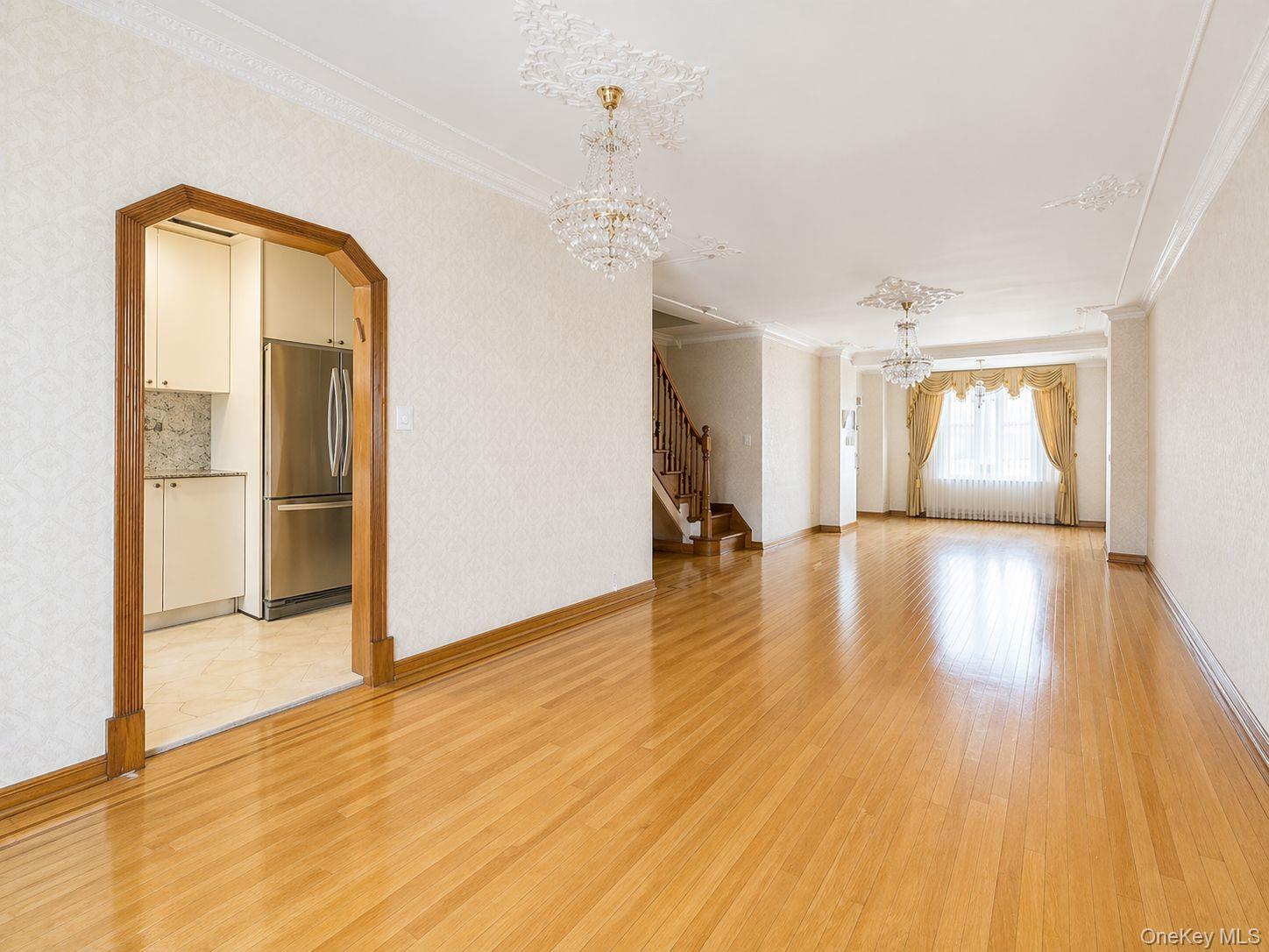 102-01 62nd Road Queens, NY 11375 - Photo 1 of 16 a view of a living room and a wooden floor