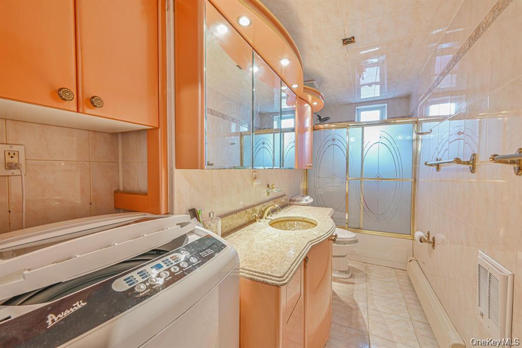 102-01 62nd Road Queens, NY 11375 - Photo 14 of 16 a bathroom with a sink and a mirror