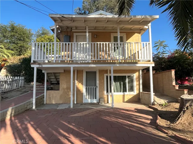 a front view of a house with a porch