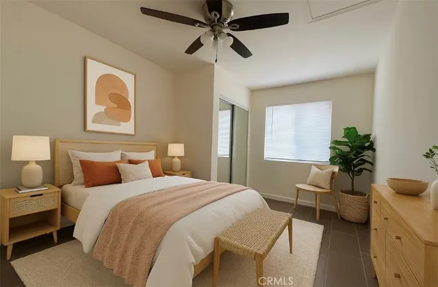 a bedroom with a bed and a couch