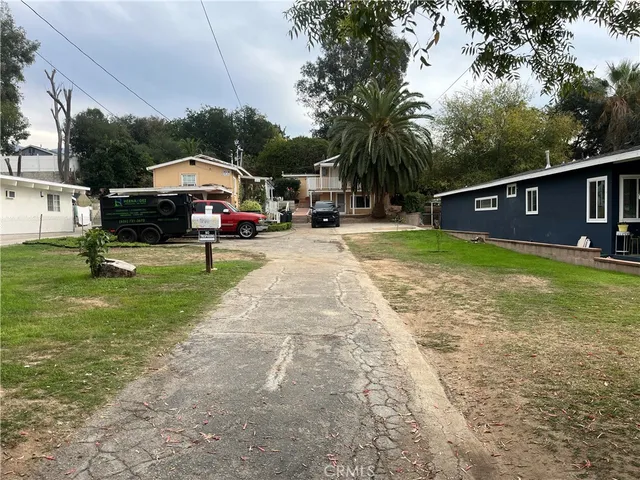 a view of a house with garden and sitting area