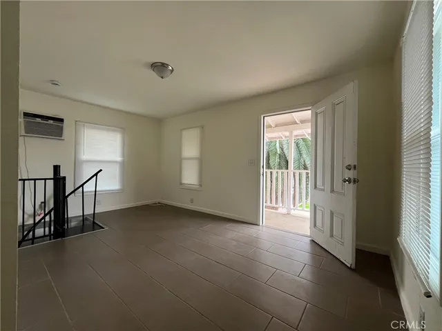 a view of an empty room and window