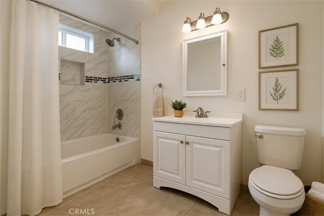 a bathroom with a sink a toilet and a bathtub