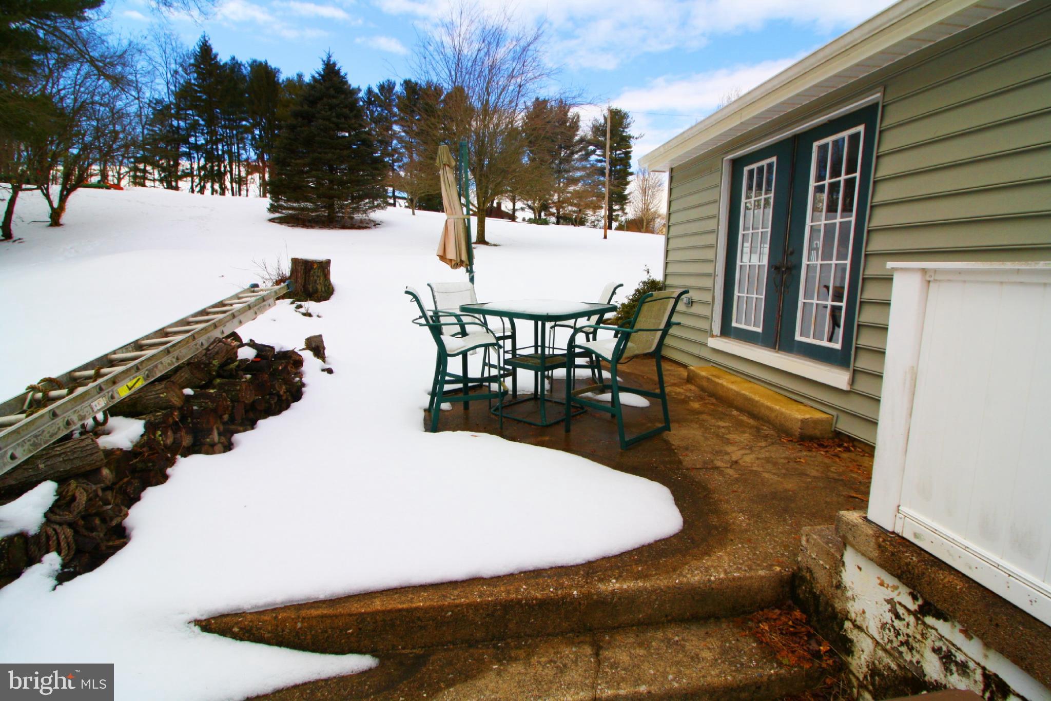 3453 Bowser Road New Freedom, PA 17349 - Photo 8 of 65 a view of a swimming pool with outdoor seating