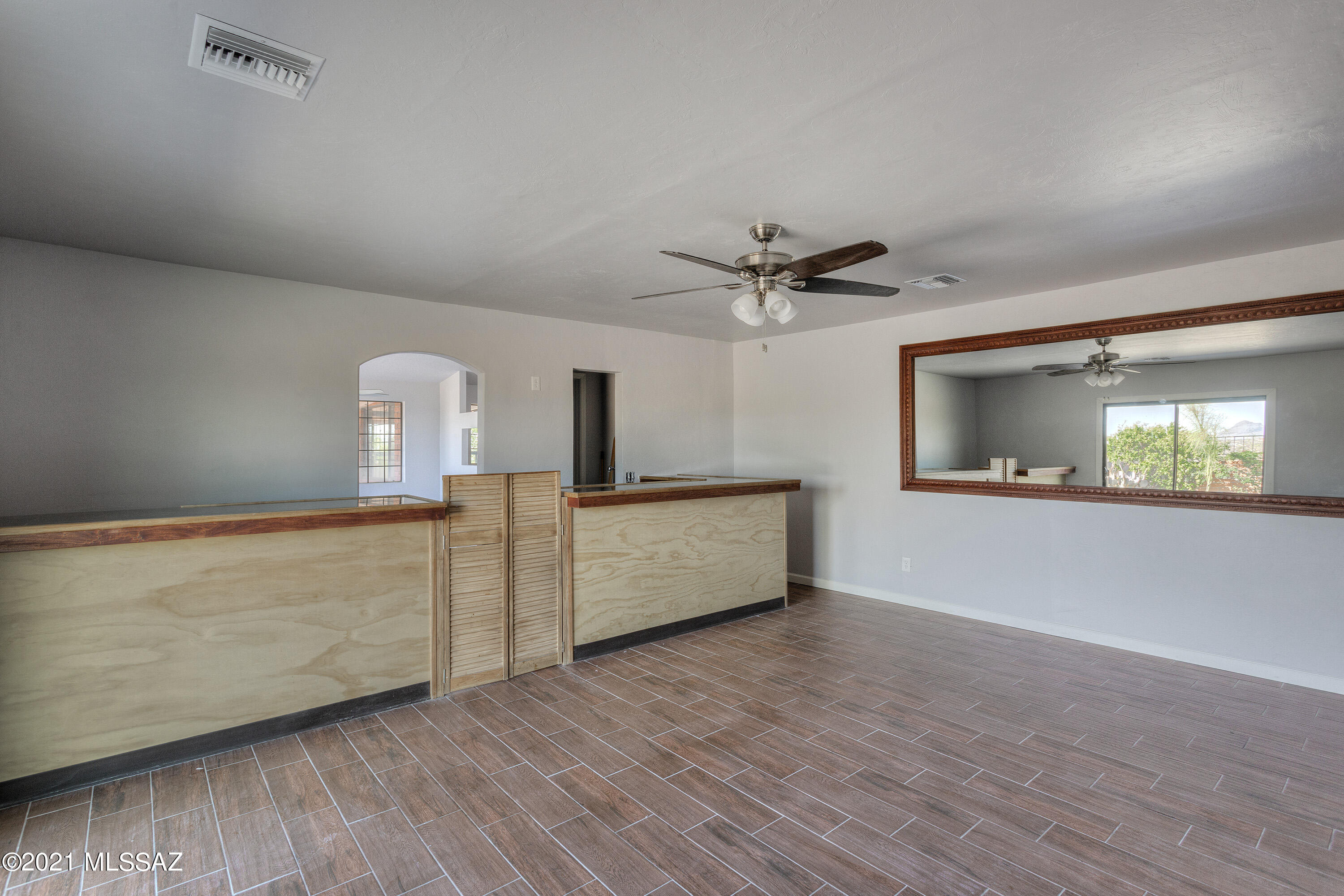 1096 Montosa Circulo Rio Rico, AZ 85648 - Photo 26 of 39 a view of an empty room with window and wooden floor